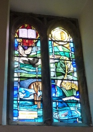 Stained glass windows in St Leonard's in Thorpe.