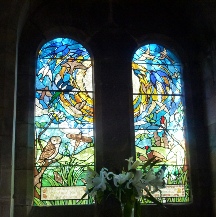 Stained glass windows in Parwich Church.
